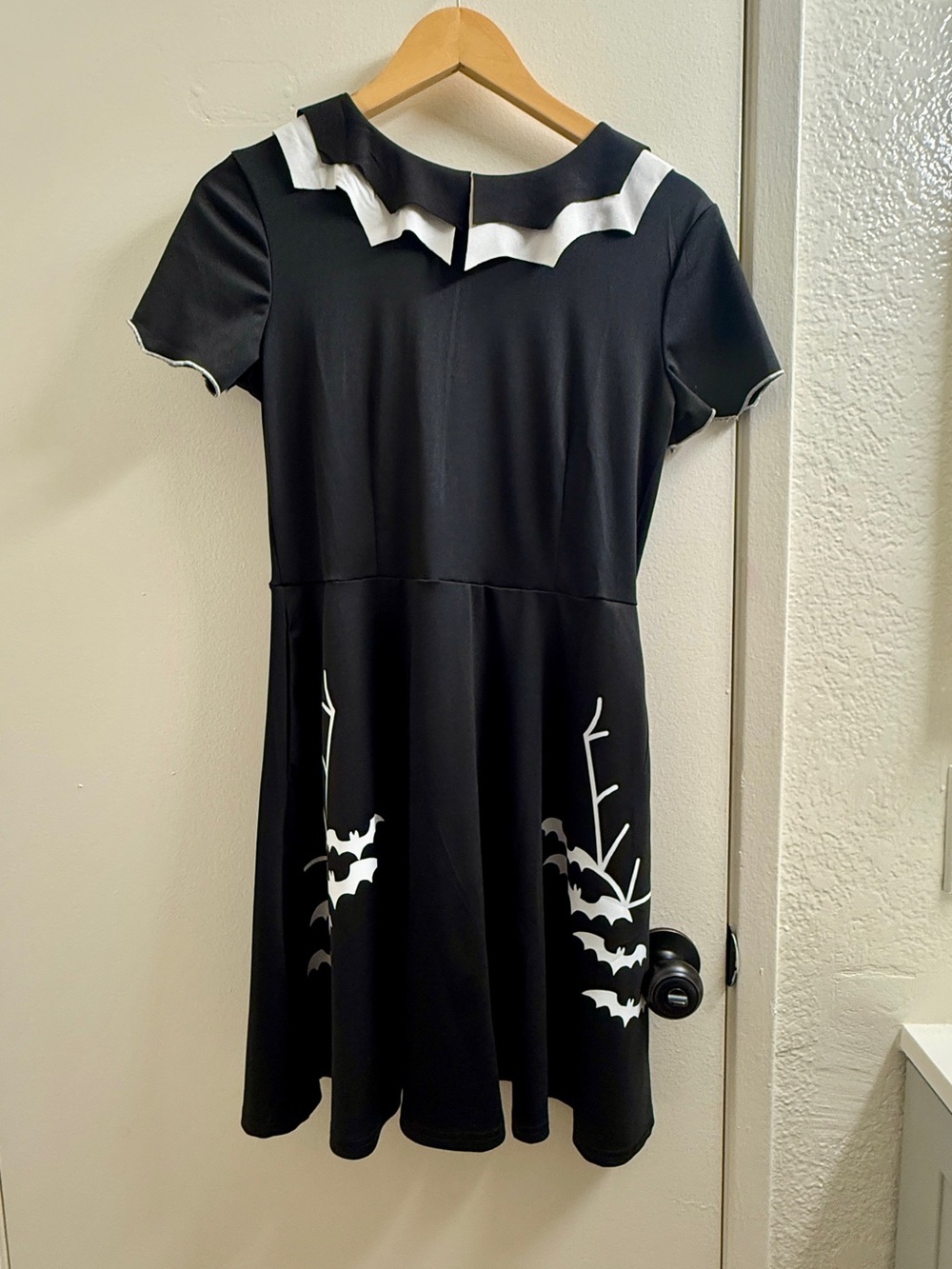 Black and White Short-Sleeve Casual Dress with Bat Accent